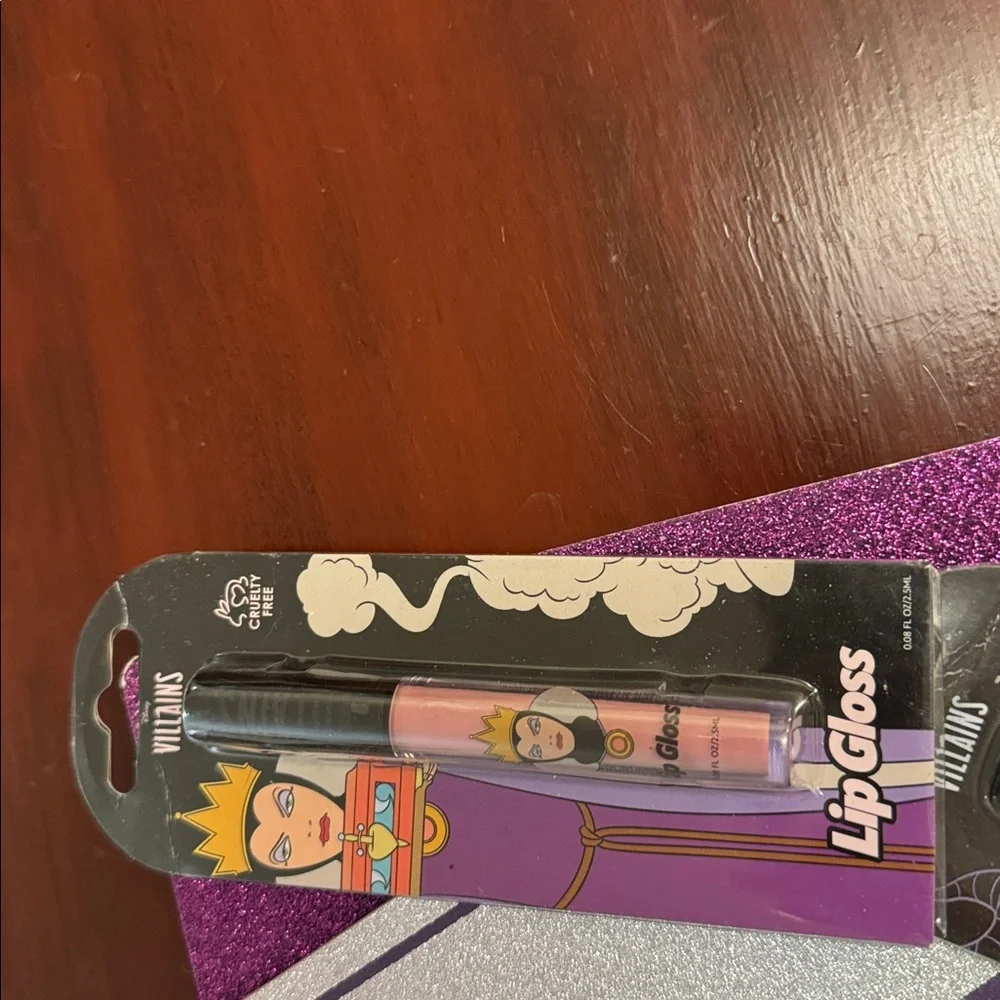 NWT 2 color DISNEY Female VILLAINS cruelty free lip gloss. Yes I see the irony.
